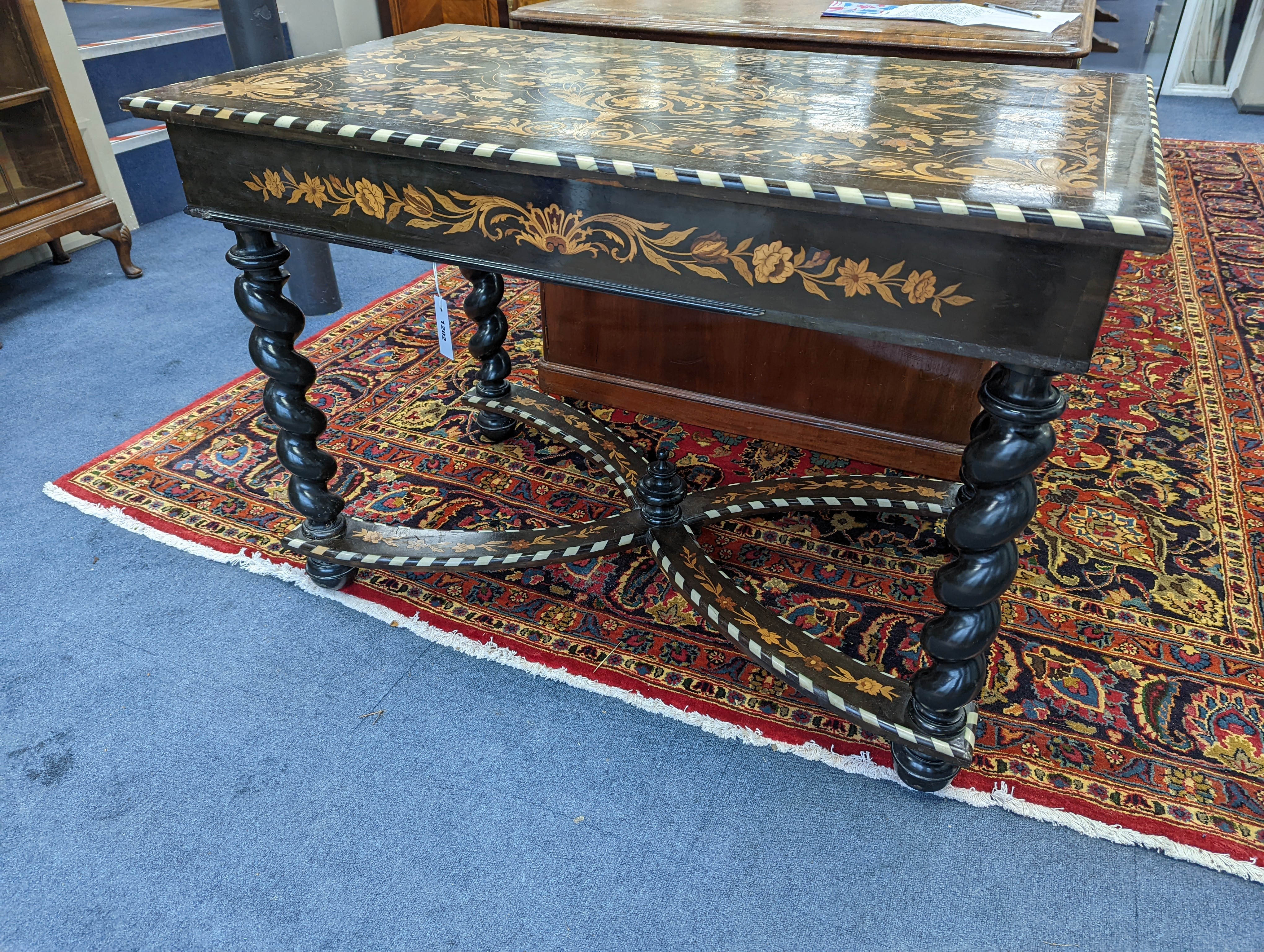 A William and Mary style rectangular marquetry and bone inlaid walnut side table, fitted drawer on ebonised spiral turned under frame with shaped X stretcher width 110cm, depth 67cm, height 78cm